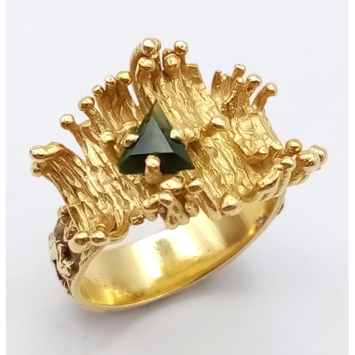 297 - 18K YELLOW GOLD FANCY BARK EFFECT RING WITH A GREEN STONE THAT HAS A CHIP ON CORNER 

WEIGHT: 8.6G 
... 