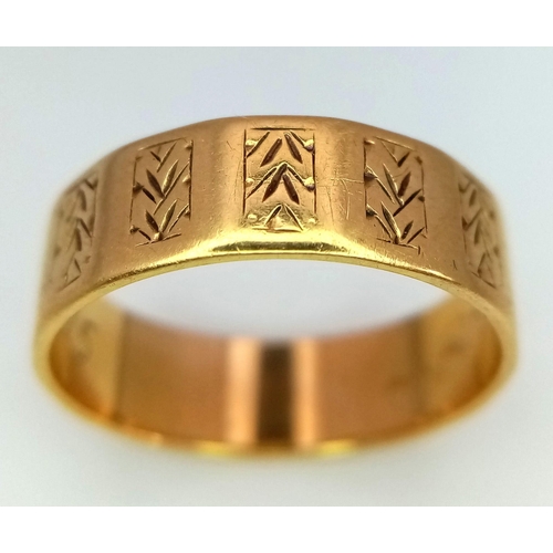 528 - AN 18K GOLD BAND RING WITH GEOMETRIC PATTERN .  4.6gms   size P/O