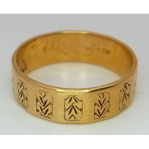 528 - AN 18K GOLD BAND RING WITH GEOMETRIC PATTERN .  4.6gms   size P/O