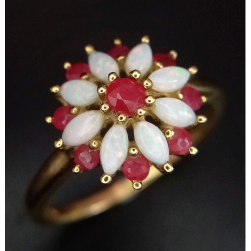 651 - A LOVELY VINTAGE 9K YELLOW GOLD RUBY & OPAL RING SET IN FLORAL DESIGN, WEIGHT 2.7G SIZE R