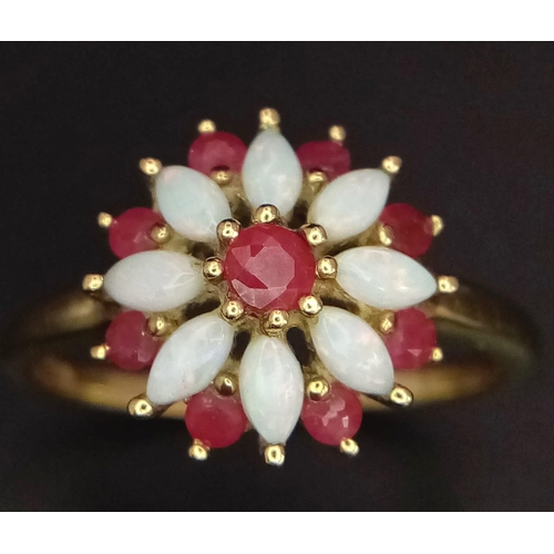 651 - A LOVELY VINTAGE 9K YELLOW GOLD RUBY & OPAL RING SET IN FLORAL DESIGN, WEIGHT 2.7G SIZE R