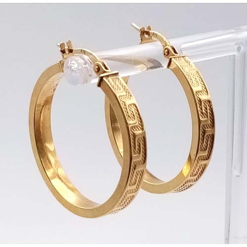 706 - A PAIR OF 9K HOOP EARRINGS WITH GRECIAN PATTERN .  2.6gms