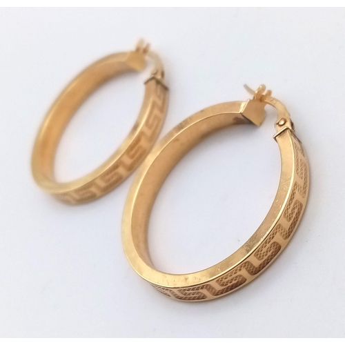 706 - A PAIR OF 9K HOOP EARRINGS WITH GRECIAN PATTERN .  2.6gms