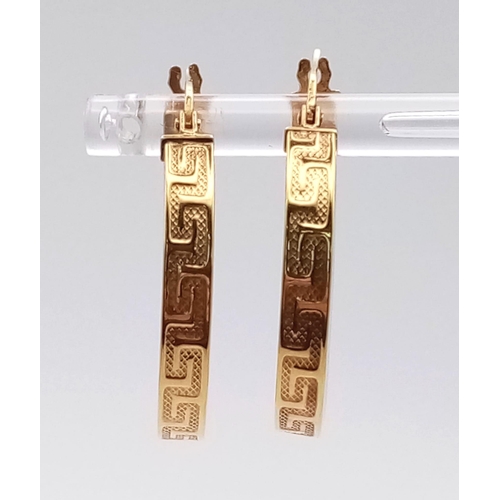 706 - A PAIR OF 9K HOOP EARRINGS WITH GRECIAN PATTERN .  2.6gms