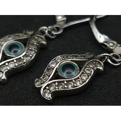 892 - Stunning Sterling Silver Evil Eye Design Stone Set Earrings. 

3cm Length, Secure Fit.