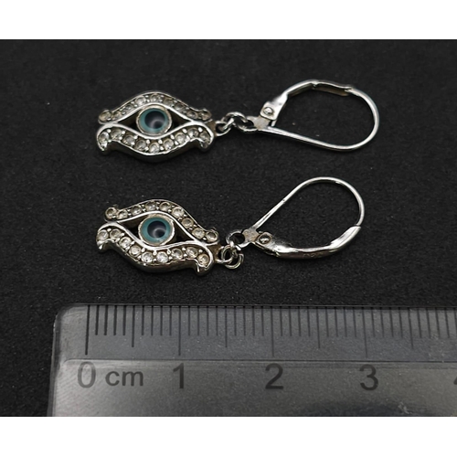 892 - Stunning Sterling Silver Evil Eye Design Stone Set Earrings. 

3cm Length, Secure Fit.