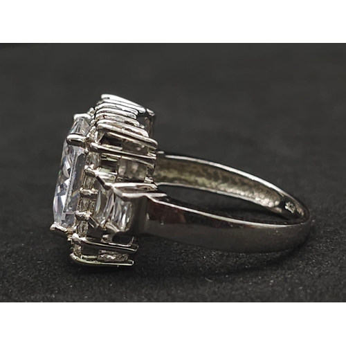 927 - A Stunning Ex Display Tier Mounted Cubic Zirconia Set Ring, Size P. 
Set with a 1cm Square Cut raise... 