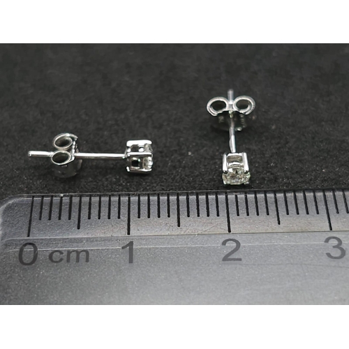 582 - A Pair of 18K White Gold Diamond Stud Earrings. 0.2ctw. As new. 0.51g total weight.