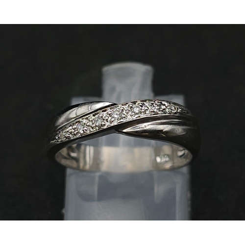 597 - 9K WHITE GOLD DIAMOND TWIST BAND RING 

WEIGHT: 2.4G 
SIZE K