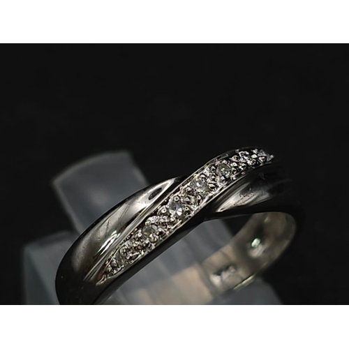 597 - 9K WHITE GOLD DIAMOND TWIST BAND RING 

WEIGHT: 2.4G 
SIZE K