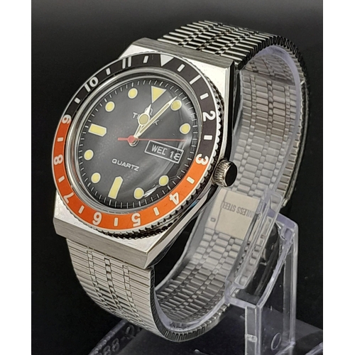 716 - An unworn Q Timex Reissue Watch.

38mm Stainless Steel Case. Black & Red Bezel Model.

Full Box & Ma... 