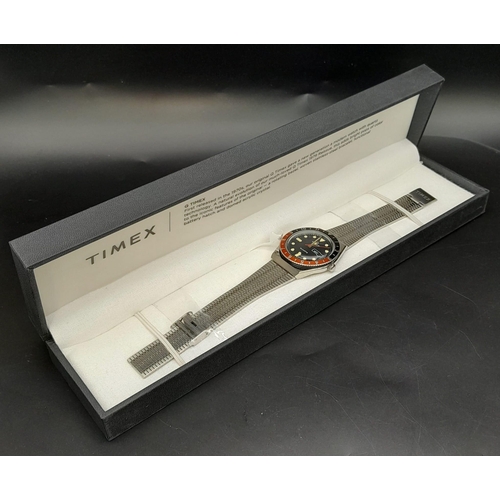 716 - An unworn Q Timex Reissue Watch.

38mm Stainless Steel Case. Black & Red Bezel Model.

Full Box & Ma... 