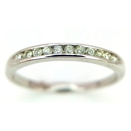 307 - 18K WHITE GOLD DIAMOND 1/2 ET RING 0.16CT

WEIGHT: 1.8G 
SIZE N