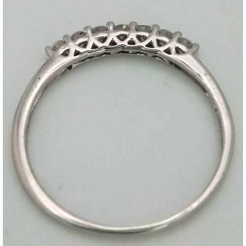 611 - 9K WHITE GOLD DIMAOND BAND RING 0.20CT 

WEIGHT: 1.2G 
SIZE K