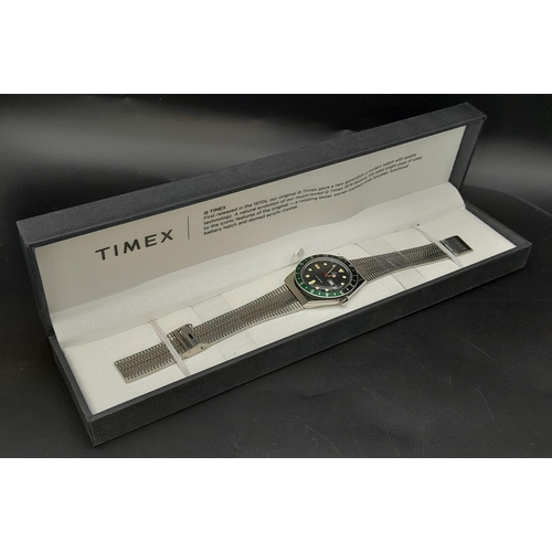 723 - An Unworn Q Timex Reissue.

38mm Stainless Steel case, Black & Green Bezel model.

Comes in presenta... 