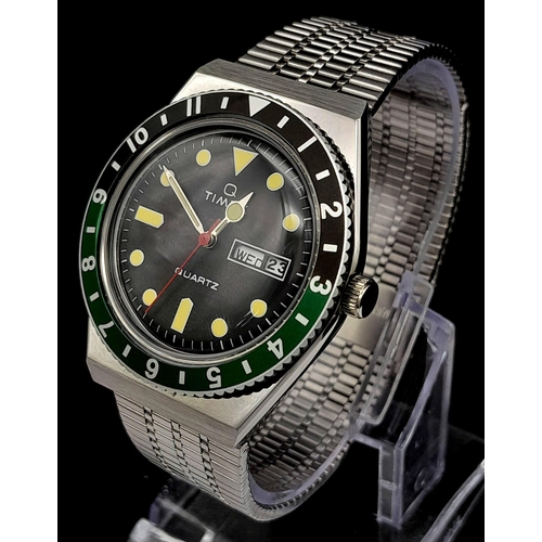 723 - An Unworn Q Timex Reissue.

38mm Stainless Steel case, Black & Green Bezel model.

Comes in presenta... 