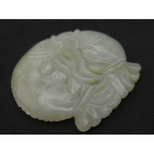 563 - A Vintage Jade Feng Shui Two Fish Amulet. 6cm x 5cm.