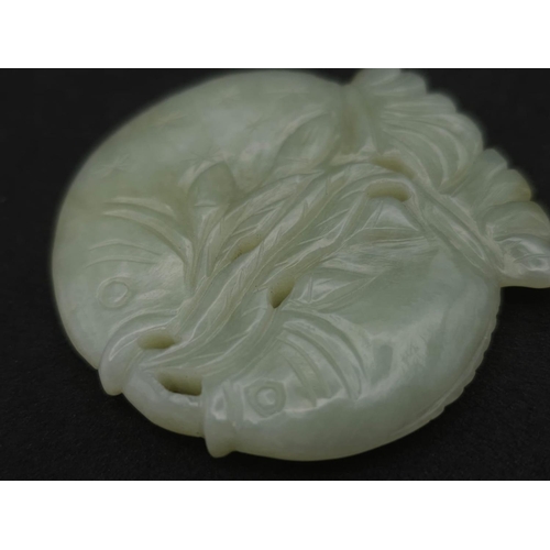 563 - A Vintage Jade Feng Shui Two Fish Amulet. 6cm x 5cm.