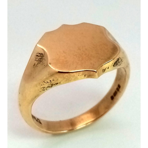 708 - A 9K Yellow Gold Shield Shape Signet Ring. Size R. 7.3g weight. Full UK hallmarks.