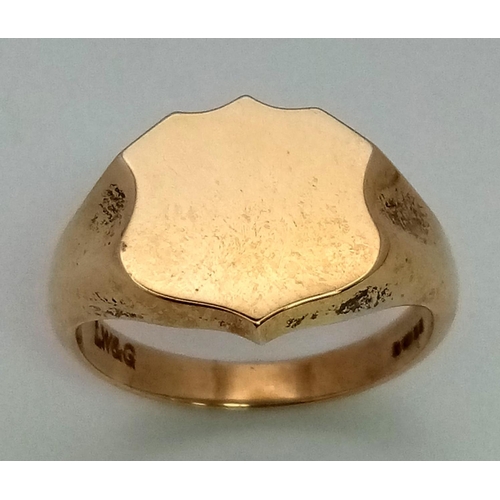 708 - A 9K Yellow Gold Shield Shape Signet Ring. Size R. 7.3g weight. Full UK hallmarks.