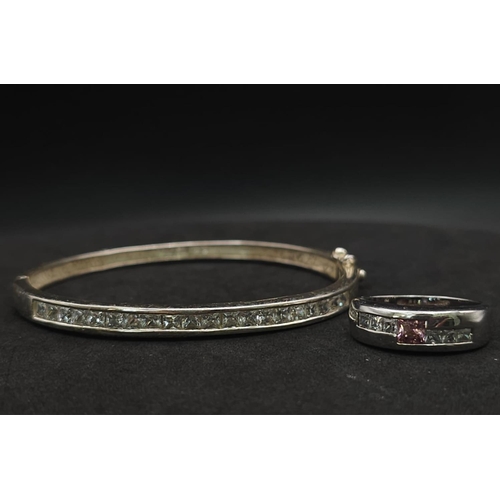 959 - Sterling silver channel set hinged bangle (diameter 6cm) with princess cut CZ stones, alongside a st... 