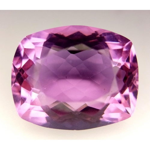 711 - A 27ct Lab Created Pink Rectangular Cut Topaz. Well faceted with no visible marks or inclusions. Tri... 