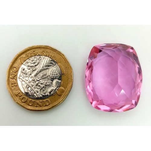 711 - A 27ct Lab Created Pink Rectangular Cut Topaz. Well faceted with no visible marks or inclusions. Tri... 