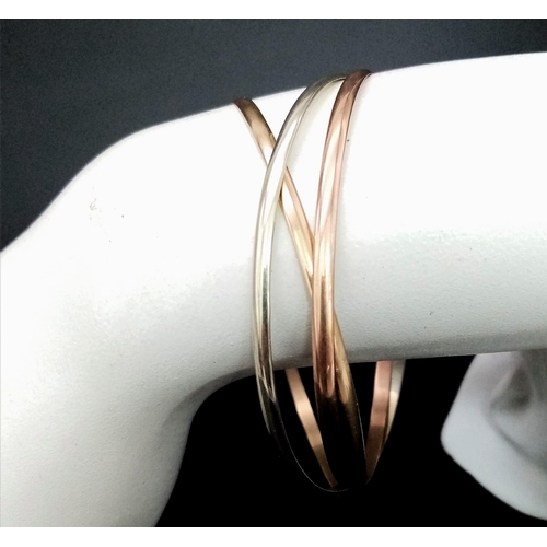 1126 - A 9K Tricolour Gold Interlocking Wedding Bangle. 12.73g weight.