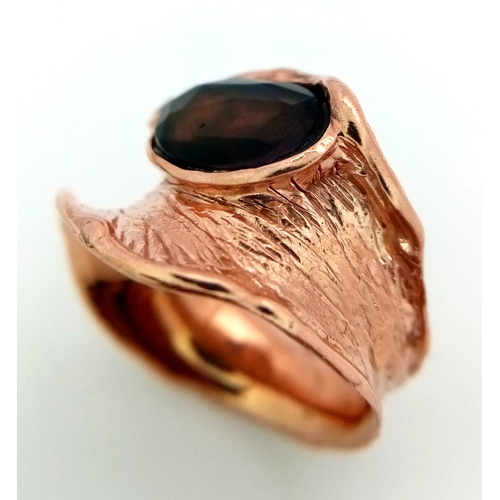 225 - A very glamorous, with a unique free-form design, sterling silver and rose gold filled ring, with an... 