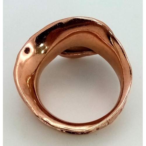 225 - A very glamorous, with a unique free-form design, sterling silver and rose gold filled ring, with an... 