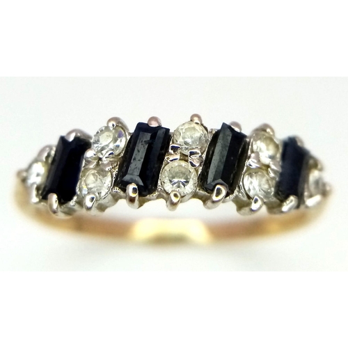 536 - An 18K Yellow Gold Sapphire and White Stone Ring. Size O/P. 1.66g total weight.