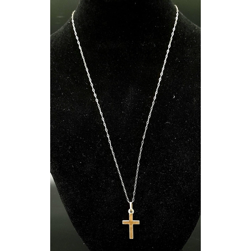 627 - A 9K Yellow Gold Cross Pendant on a 9K Yellow Gold Disappearing Necklace. 25mm and 46cm. 0.95g total... 