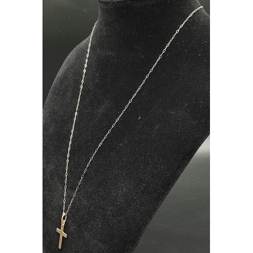 627 - A 9K Yellow Gold Cross Pendant on a 9K Yellow Gold Disappearing Necklace. 25mm and 46cm. 0.95g total... 