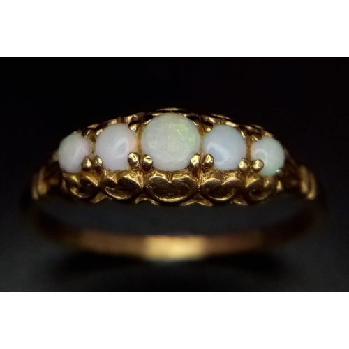 884 - A Vintage 9K Yellow Gold Five Opal Gemstone Ring. Five graduating colour-play opals. Full UK hallmar... 