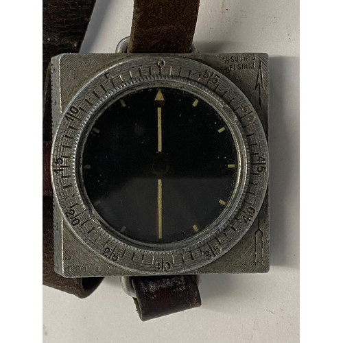 913 - A WW2 Suunto Finnish M34 Wrist Compass with Leather Strap - Serial number of 18112. ML 283