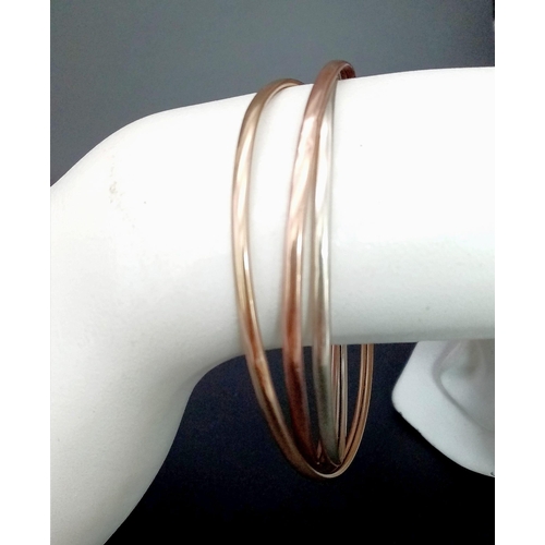 121 - A 9K Tricolour Gold Wedding Interlocking Bangle. 9.87g weight.