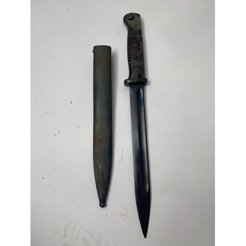 143 - A German WW2 K98 Camo Bayonet with Scabbard. It has markings of 3838f and the code S238G. The scabba... 