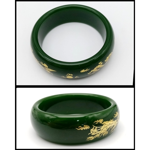 258 - A fashionable, Chinese, spinach green bangle with two gilded celestial dragons, offering glamour and... 