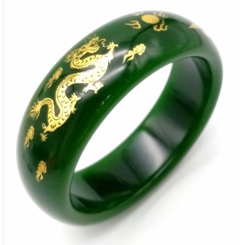 258 - A fashionable, Chinese, spinach green bangle with two gilded celestial dragons, offering glamour and... 