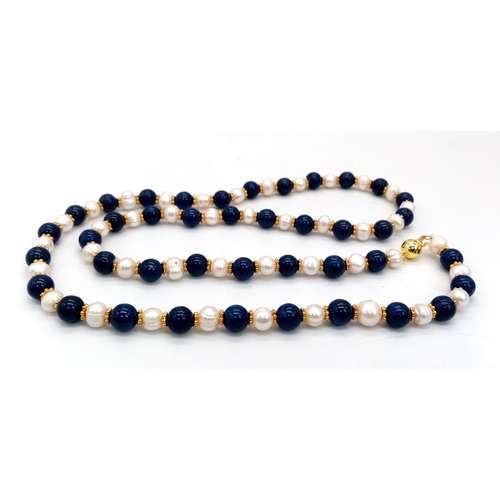 408 - A Cultured Pearl and Lapis Lazuli Matinee Length Necklace. 8mm lapis and pearls. Gilded spacers and ... 