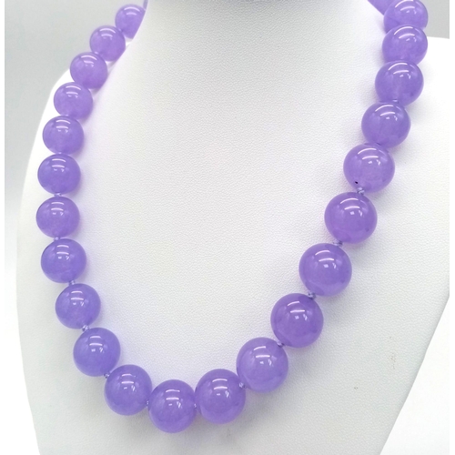 435 - A Large Lavender Jade Beaded Necklace. 42cm necklace length. Beads 14mm.