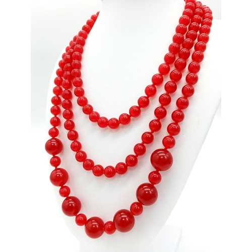 817 - A Rope Length Red Jade Necklace with Different Sized Jade Beads - 8mm and 14mm. Necklace length - 14... 