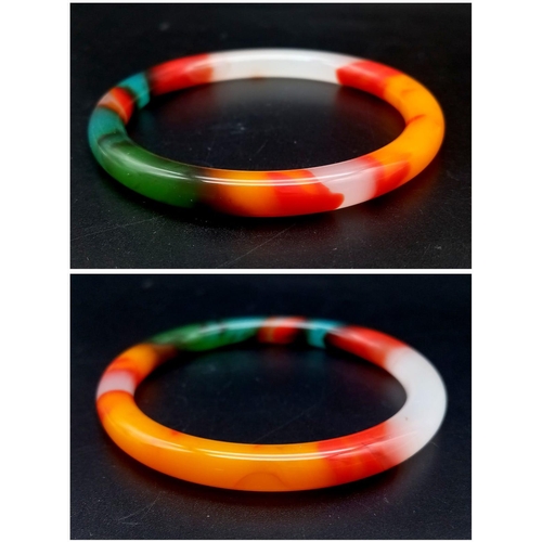 440 - A Multi-Coloured Jade Thin Bangle. An explosion of colour. 6cm inner diameter. 8mm width.