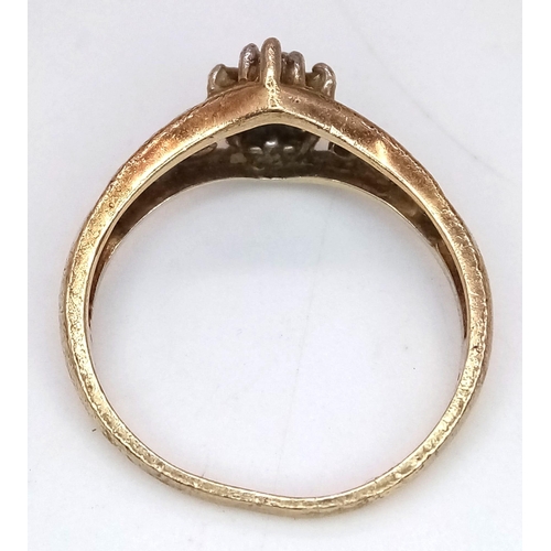 581 - An Antique 10K Gold Diamond Cluster Ring. Pierced decoartion at sides. Size L. 2.4g total weight.