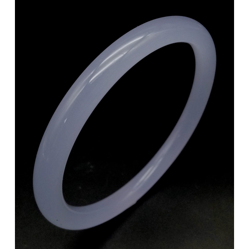 921 - A Chinese Lavender Jade Thin Bangle. 62mm inner diameter. 7mm width.