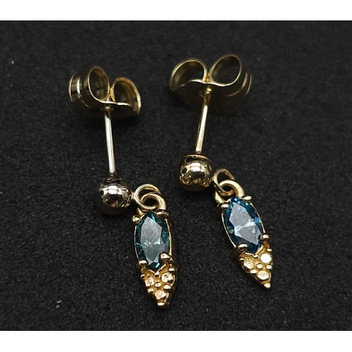 1005 - A Pair of 14K Yellow Gold Fancy Blue Diamond Earrings. 0.30ctw. 1.05g total weight.