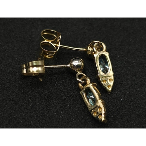 1005 - A Pair of 14K Yellow Gold Fancy Blue Diamond Earrings. 0.30ctw. 1.05g total weight.