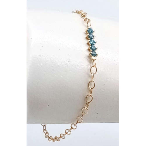 1015 - A 14K Yellow Gold Fancy Blue Five-Stone Diamond Bracelet. 
0.35ctw. 16cm length. 1.45g total weight.