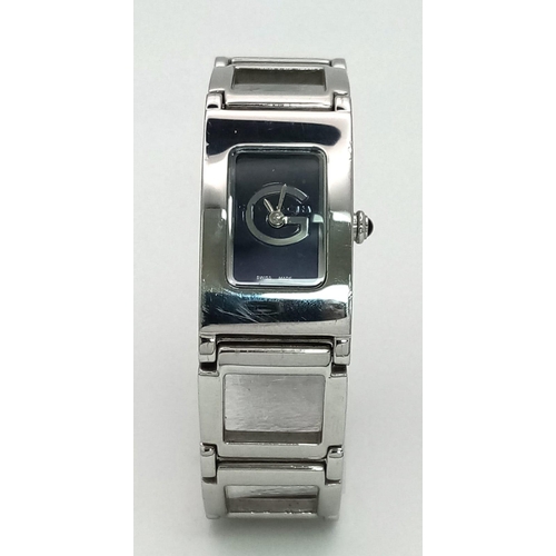 127 - A polished, stainless steel, ladies GIVENCHY-Paris watch, rectangular case 26 x 17 mm, dark blue dia... 