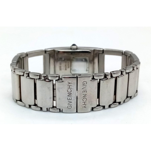 127 - A polished, stainless steel, ladies GIVENCHY-Paris watch, rectangular case 26 x 17 mm, dark blue dia... 